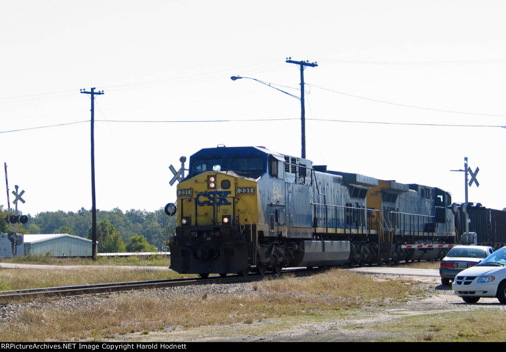 CSX 231 & 308 lead a train across Bridges Street